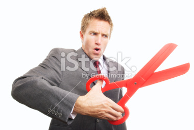 stock-photo-15135547-businessman-cutting-with-big-pair-of-red-scissors-snip-1
